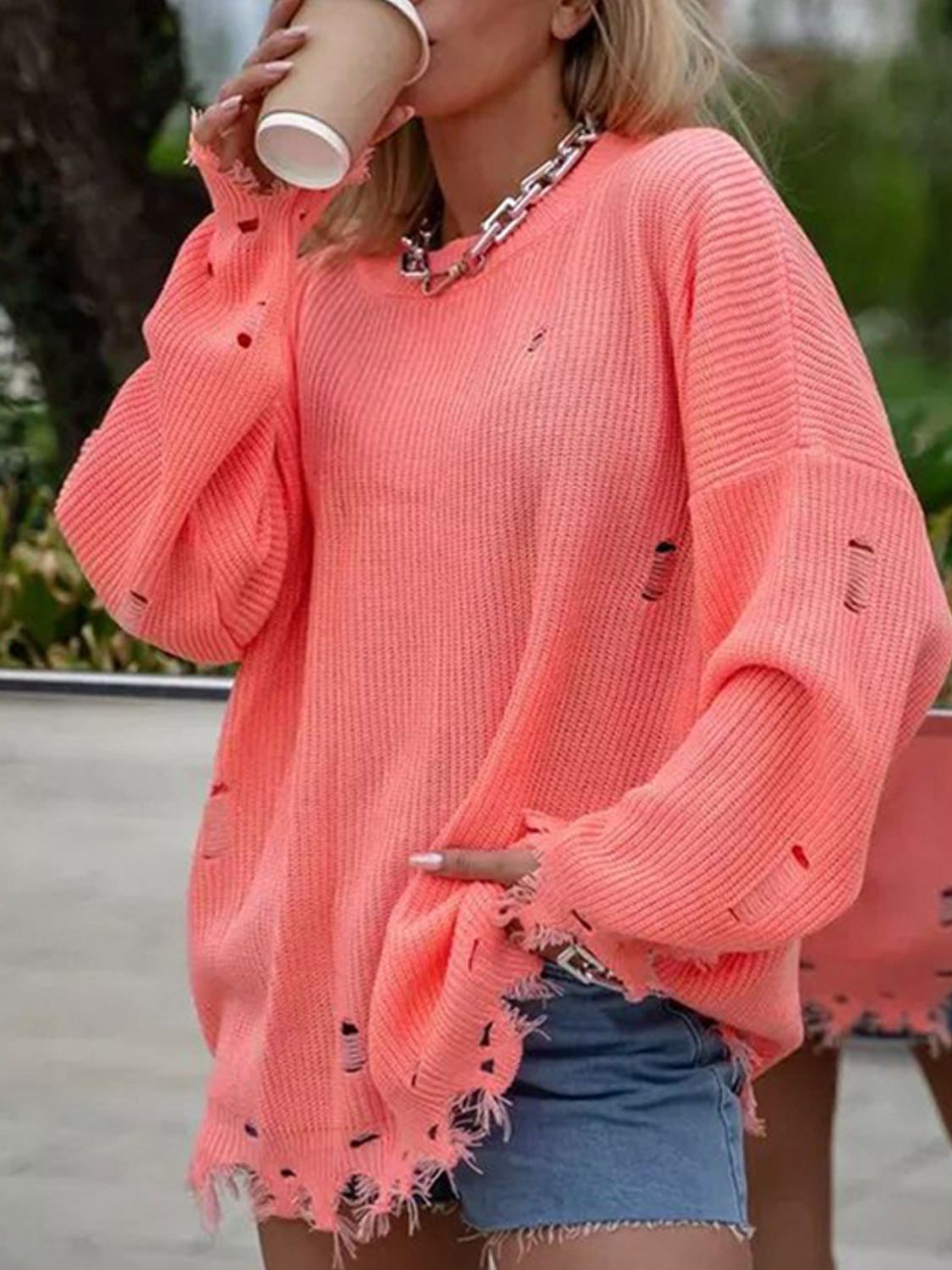 Distressed Round Neck Long Sleeve Sweater                            .